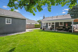 Back of property with a patio, an outdoor hangout area, roof with shingles, and cooling unit