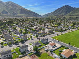 Aerial perspective of suburban area with a mountainous background