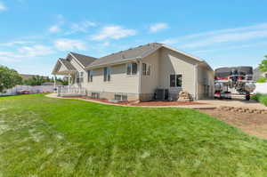 Rear view of house with central AC and a patio