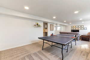 Game room with carpet floors, recessed lighting, and baseboards