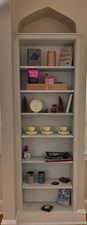 View of built-in bookshelves. There are two bookshelves in the library