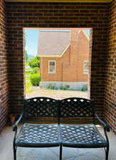 Front porch with brick wall