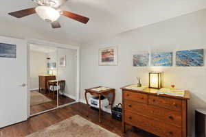 Sitting room featuring wood-type flooring, ceiling fan, and baseboards