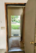 View of doorway Passage to storage area behind the garage. Also exits to the back yard.