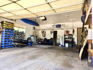 Garage featuring a garage door opener