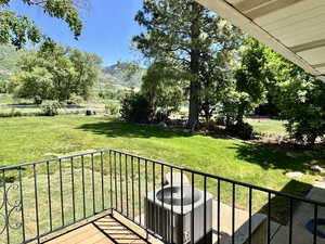 Back yard from rear deck, featuring a mountain view