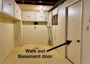 Washroom with cabinet space and walk-out basement.