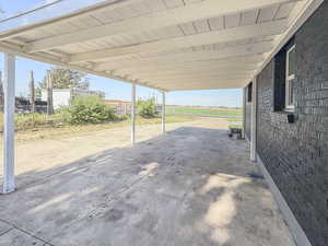 View of patio / terrace featuring an attached carport