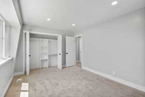 Unfurnished bedroom featuring carpet flooring, recessed lighting, and baseboards
