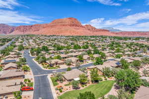 Aerial view of residential area with a mountain backdrop