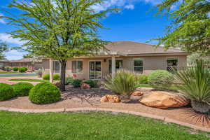 Single story home featuring stucco siding and a tiled roof