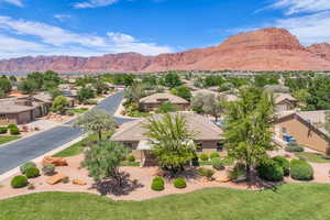 View of mountain background featuring nearby suburban area