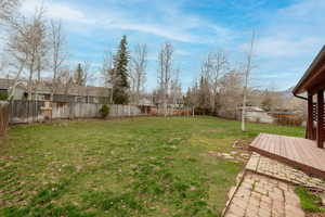 View of yard featuring a wooden deck