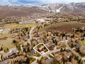 View of property location featuring property boundaries highlighted, a mountainous background, and nearby suburban area