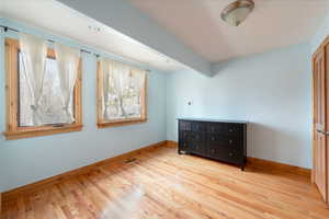 Bedroom with baseboards and light wood-style floors