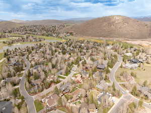 View of property location featuring nearby suburban area and a mountainous background