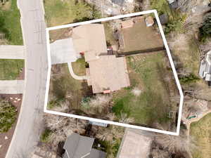 Aerial view of property and surrounding area featuring property boundaries highlighted