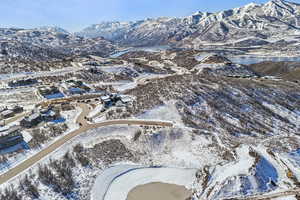 Snowy aerial view featuring a mountain view