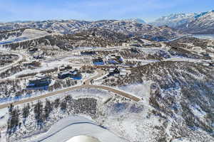 Snowy aerial view featuring a mountain view