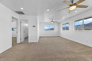 Unfurnished bedroom with light colored carpet, recessed lighting, a textured ceiling, and ceiling fan