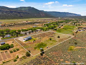 View of rural area featuring property parcel outlined and a mountain backdrop