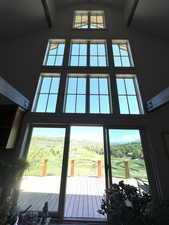 Entryway with high vaulted ceiling and healthy amount of natural light