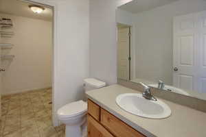 Bathroom featuring vanity and toilet