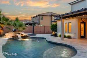 Pool at dusk with a patio