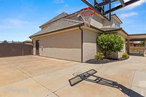 View of sport court featuring a gate