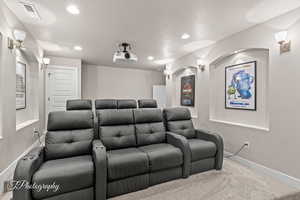 Cinema featuring carpet flooring, recessed lighting, baseboards, and a textured ceiling