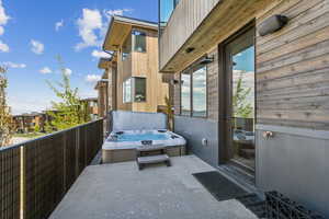 View of patio / terrace featuring a hot tub