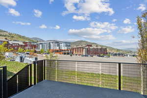 View of patio / terrace featuring a mountain view and a balcony