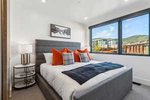Bedroom with baseboards, carpet, and recessed lighting