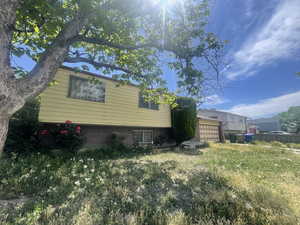View of side of property with brick siding