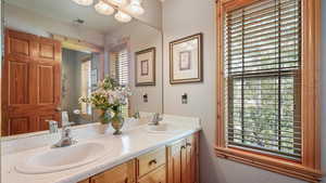 Bathroom with toilet and double vanity