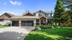 Craftsman-style home with an attached garage, concrete driveway, stucco siding, roof with shingles, and stone siding