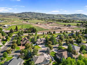 Aerial view of residential area featuring a mountain backdrop