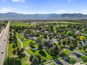 Aerial perspective of suburban area featuring a mountainous background