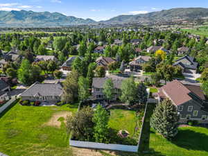 Aerial view of residential area featuring a mountain backdrop