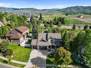 View of subject property featuring a mountainous background