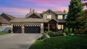 View of front of home featuring stucco siding, an attached garage, concrete driveway, and a shingled roof