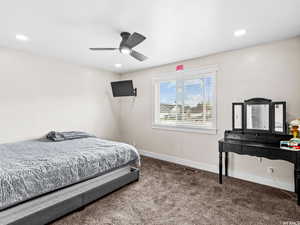 Bedroom with carpet flooring, baseboards, recessed lighting, and a ceiling fan