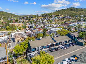 Aerial view of residential area featuring a mountain backdrop