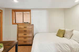Bedroom featuring light wood-style flooring and recessed lighting