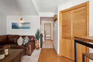 Living area featuring light wood-style flooring and baseboards