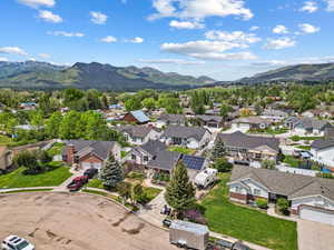 Aerial perspective of suburban area with a mountain backdrop