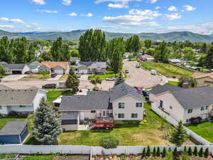 Aerial view of residential area featuring a mountainous background
