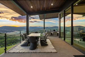 View of patio / terrace featuring a mountain view and outdoor dining space