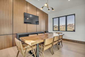 Dining area featuring light wood-style floors and baseboards