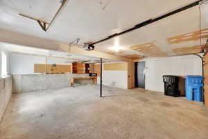 Garage featuring a garage door opener